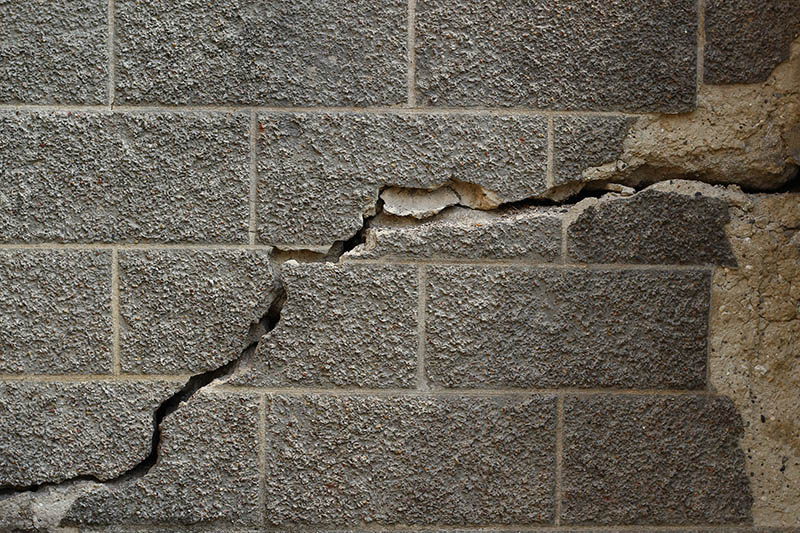 Large crack in the wall of the house, background